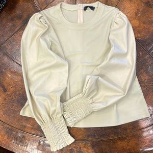 Women’s top with faux leather sleeves